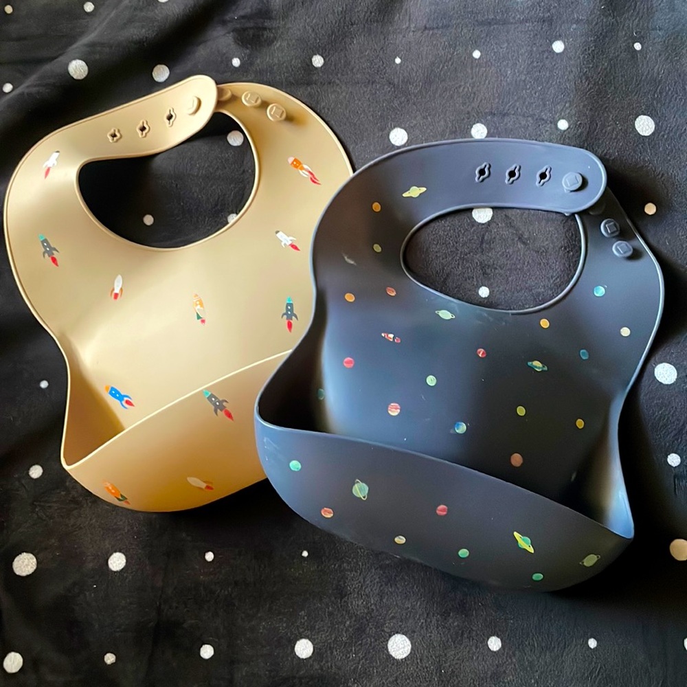 Pair of Mushie Silicone Bibs